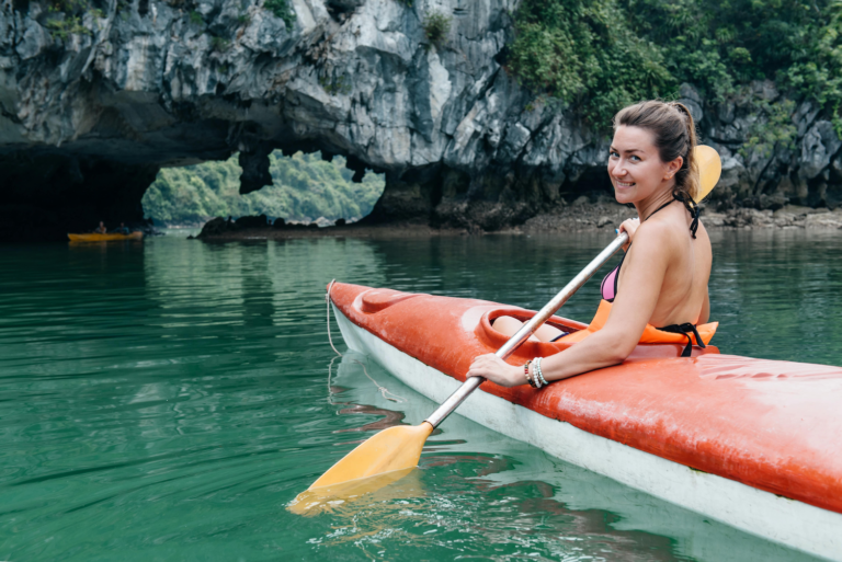 A woman kayaking in vietnam